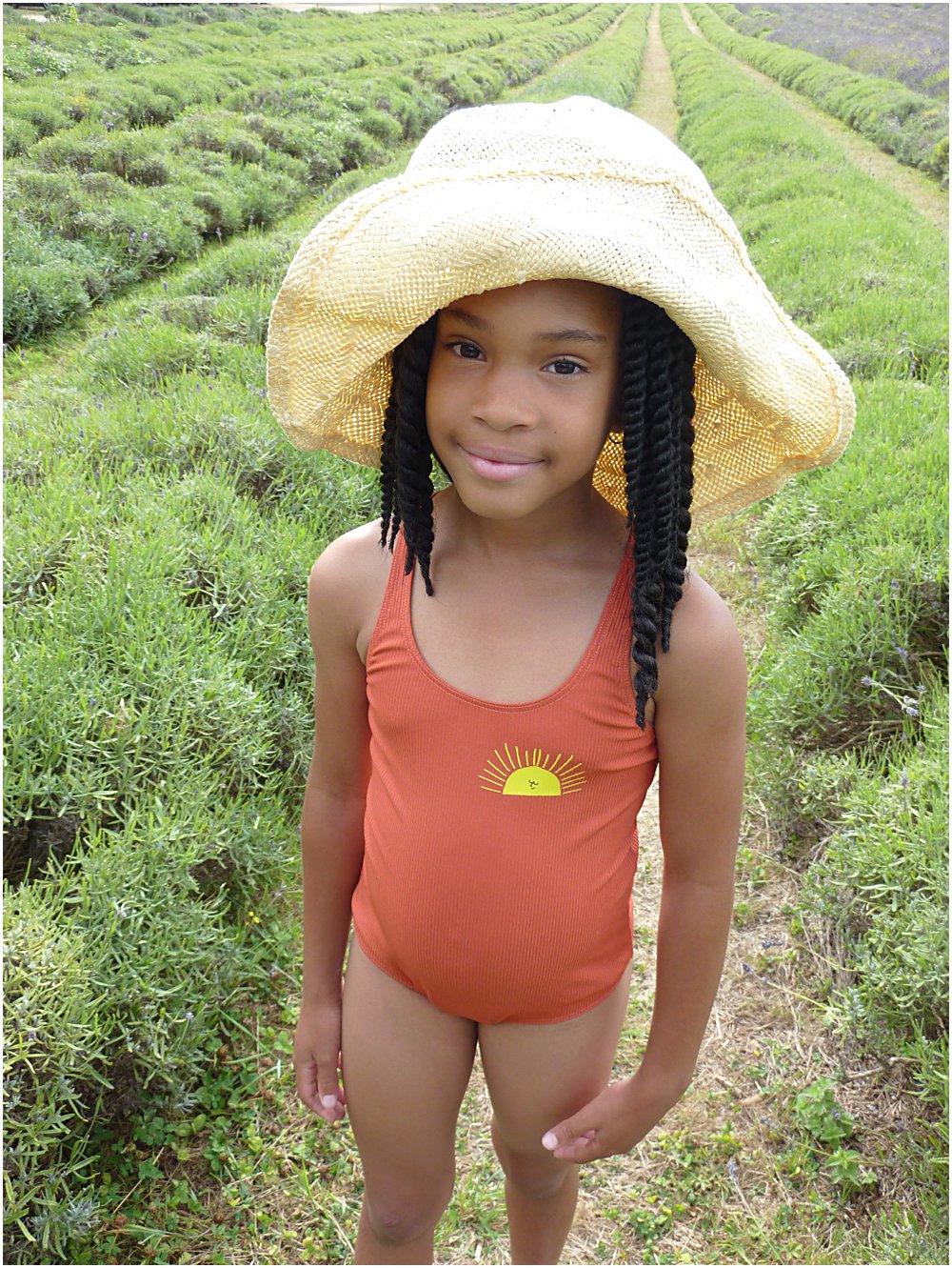Little black girl wearing Boho Choses sun swimsuit